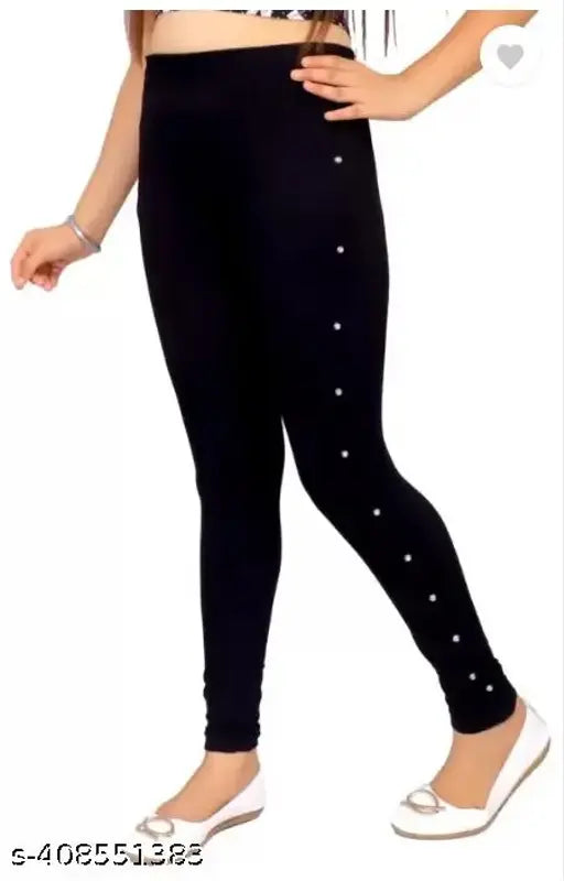 Black cotton blend jegging with embellishments, ideal for youth fashion