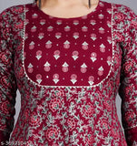 The image features a woman wearing a printed anarkali kurta in wine color, designed with embroidery and paisley print patterns. It appears to be made of rayon fabric and possibly has long sleeves
