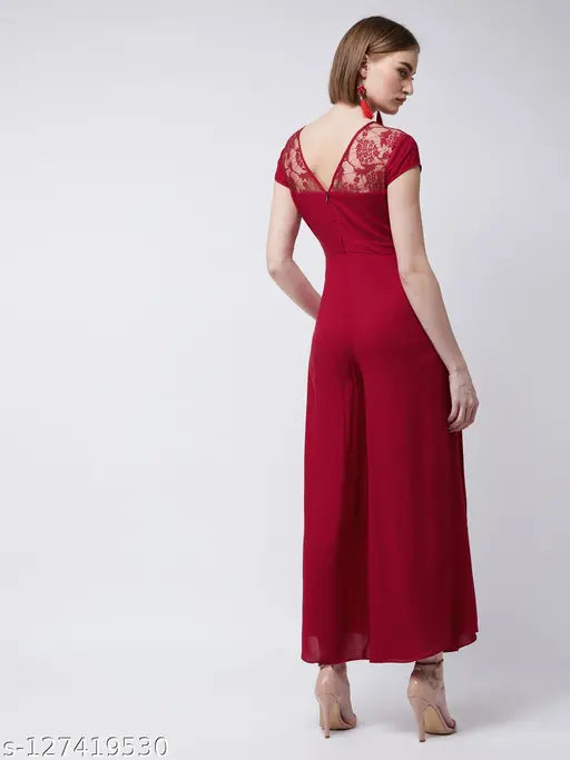 Maroon rayon wide-leg jumpsuit by Miss Chase, has pleated waistline, round neck, short sleeves, metallic buckle & back zip