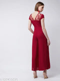 Maroon rayon wide-leg jumpsuit by Miss Chase, has pleated waistline, round neck, short sleeves, metallic buckle & back zip