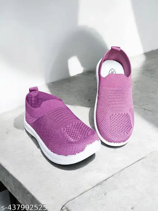 Pink and white kids sneakers with white soles