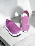Pink and white kids sneakers with white soles