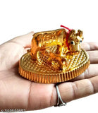 Golden metal cow and calf statue