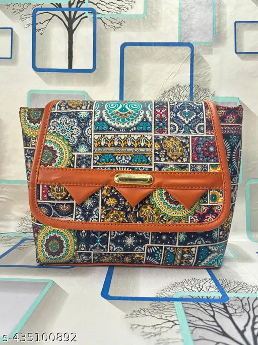 Button sling bag with paisley pattern and brown trim