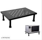 A black metal microwave oven stand in a kitchen