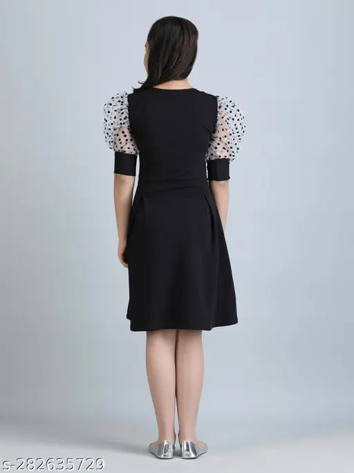 Black cotton blend solid round neck dress for girls, featuring short sleeves and perfect for ages 7-14 years. Made in India