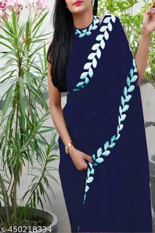Woman in dark blue sari standing outdoors, traditional attire with gold border
