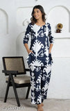 Trendy printed rayon night suit dress with floral print, round neck, and 3/4th sleeves. Ideal for sleepwear, loungewear, or nightwear. Indian-made cotton night suit set for women