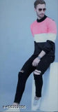 Black knee cut jeans. Man posing with hands in pockets
