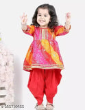 Red bandhej kurta and dhoti set for girls, three-quarter sleeves with lace embellishments. Printed rayon fabric, anarkali shape. Sizes: 12-18 months, 18-24 months, 1-2 years, 2-3 years, 3-4 years, 4-5 years, 5-6 years, 6-7 years, 7-8 years. Origin: India
