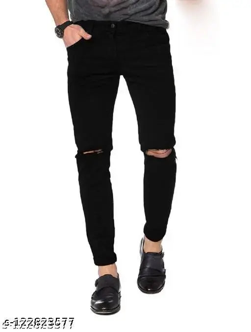 Black denim slim fit knee-cut jeans by FLETE FASHION, distressed knees. Hand wash only. Size 28/Length 39in, 30/Length 39in, 32/Length 39in (Menswear)