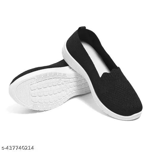 Black cotton slip-on shoes with a slightly raised sole for extra comfort