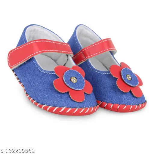 Red and blue party shoes with floral accents for a baby girl