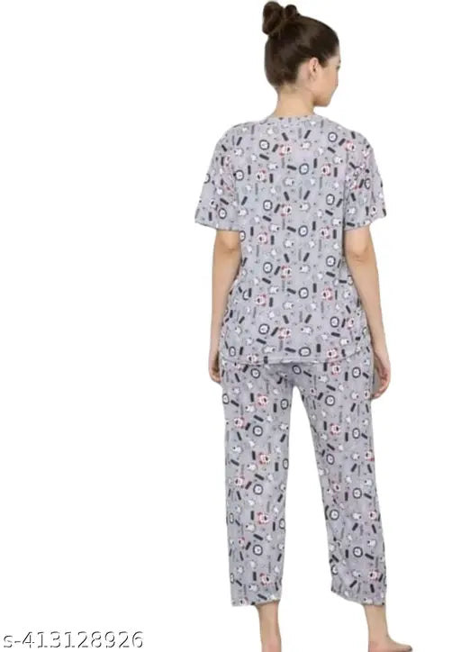 Modern silk-blend sleepwear 4-piece set, printed with a stylish design, perfect for comfortable loungewear or travel outfits. Made from stretchable fabric, featuring short sleeve t-shirts and pajama bottoms in sizes XS, S, M