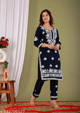 Rayon Chikankari riyon kurta pant set with printed net pattern, three-quarter sleeves, and matching bottomwear. Indian traditional attire for women
