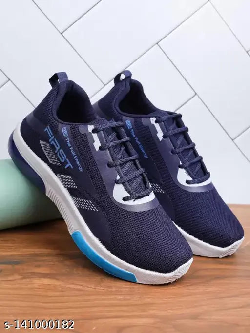 Unisex navy blue sports shoes with white sole and lace-up closure, suitable for casual wear, daily use, and running for kids