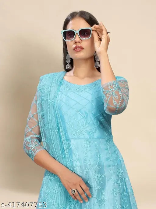 Sky net semi-stitched gown, embroidered with chain stitch work, comes with inner and dupatta. Semi-stitched for a custom fit up to 44" bust size. Length: 57 inches, 3/4 sleeves. India origin