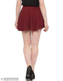 Polyester flared mini skirt, solid net, broad elastic waistband, curved hemline, breathable fabric. Multiple size options available for comfort and style. Indian-made flared skater skirt with regular rise for a versatile fit