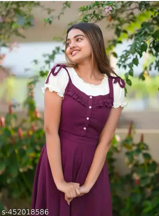 Women's wine-colored rayon dungaree dress, sleeveless with solid shoulder design, casual wear on mannequin (India)