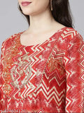 Red and gold patterned sharara suit with flared sleeves