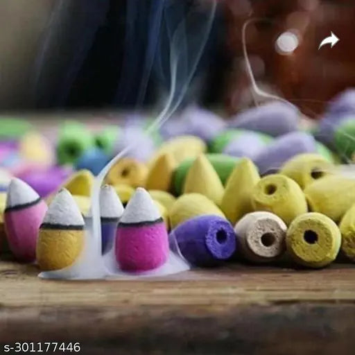 Smoky colored clay incense holders with black and white stripes, used as a centerpiece for Lord Adiyogi, Shankra smock fountain incense