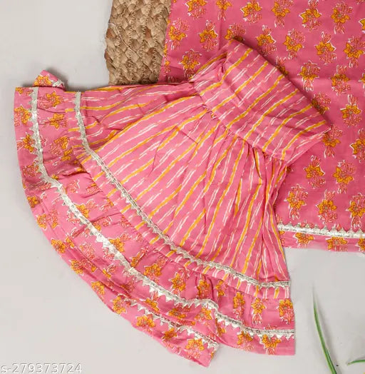 Red cotton printed kurti sharara set for baby girls with dupatta, featuring an anarkali top and sharara bottom, adorned with gota patti and dori. Comes in various sizes from 6-12 months to 5-6 years. Handmade in India
