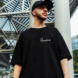 Black cotton blend oversized t-shirt with printed paradise design, men's 3/4th sleeve round neck style on display