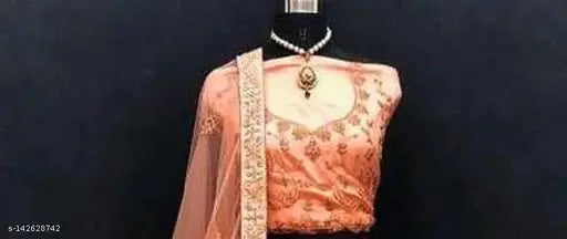 Orange embroidered Lehenga Choli set with heavy net fabric, ruffled design and satin blouse. Indian bridal wear including dupatta with lace border, semi-stitched, unstitched, and free size available