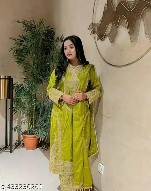 Green silk with embroidery and sequence detail