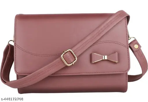 Pink leather sling bag with side bow tie closure