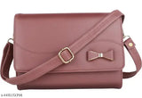 Pink leather sling bag with side bow tie closure