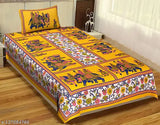 Yellow 100% cotton UniqChoice Jaipuri single bedsheet with pillow cover, floral design on a regular quality sheet