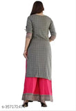 A woman wearing a block printed white kurta and pant set with a matching dupatta