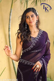 Fashionable purple chiffon saree with intricate design and pallu draped elegantly