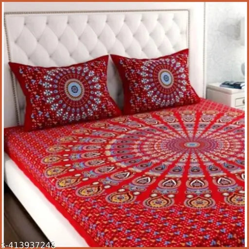 Red cotton double bedsheet with 2 pillow covers, paisley pattern, with white headboard.