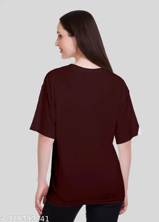 A woman wearing a black, poly cotton blend, half-sleeved sports/casual wear t-shirt