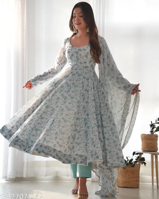 Pure orange chiffon floral print anarkali with dupatta set, ideal for summer weddings. Heavy chiffon flair, padded sleeves, and fancy neck design." (123 characters)