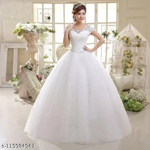 White wedding dress with a fitted bodice, long sleeves, and a floor-length hoop skirt