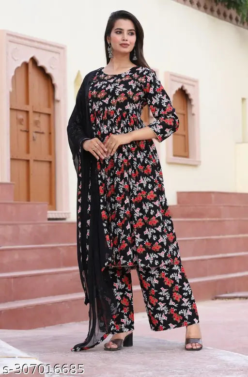 Black rayon floral print kurta pant & dupatta set (Umbrella Cut), featuring three-quarter sleeves and palazzos bottomwear. Rayon fabric ensures a luxurious feel. Perfect for special occasions or everyday wear, made in India