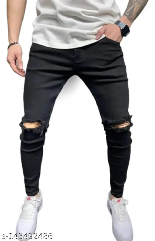 Black polycotton men's skinny ankle-length jeans with distressed knee, tapered fit and stretchable