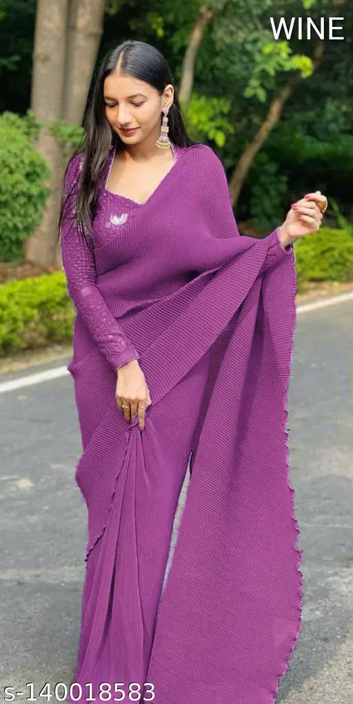 Purple pleated saree with lace border, perfect for a wedding