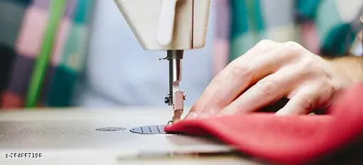 Red cotton fitted bedsheet set with microfiber pillow covers, visible sewing machine.
