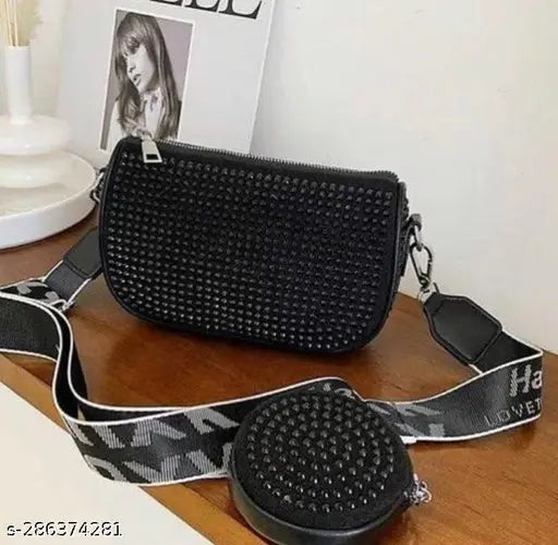 Black faux leather crossbody bag with rhinestone detailing and a mini coin purse attached