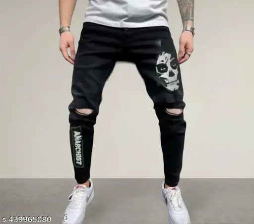 Black distressed denim jeans with printed skull and crossbones pattern, men's casual wear