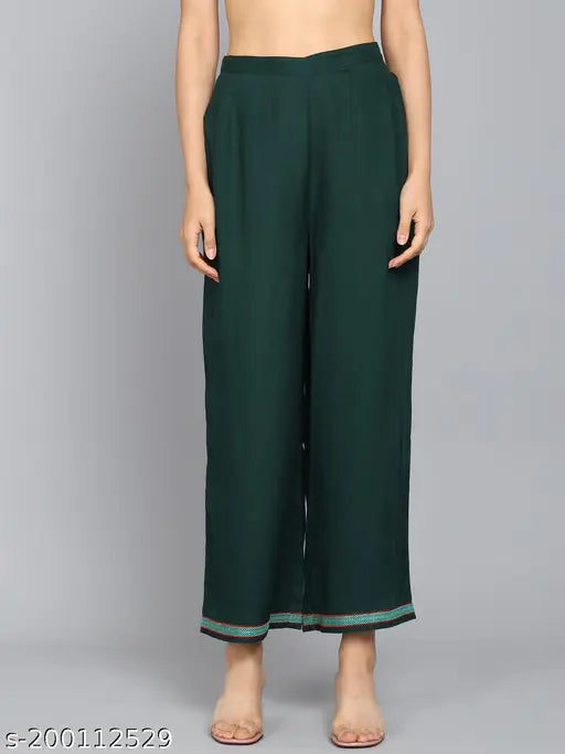 Dark green Angita women's embroidered rayon kurta set with palazzos, solid design on display
