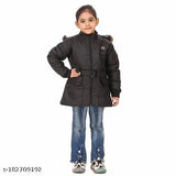A girl posing in a black hooded coat, trendy winter wear for girls