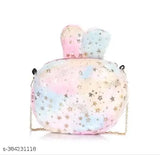 A mini pink, blue, and white glittery bag with a starry night sky background
