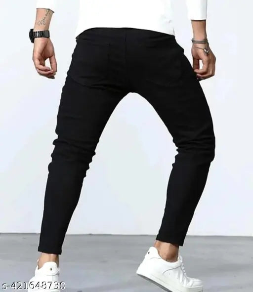 Black denim solid-pattern jeans in medium weight, featuring stretch fabric and adjustable waist. Premium black jeans for kids with curved fit, suitable for casual or everyday wear