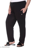 The image displays a person wearing black cotton track pants, which appear to be a plus size style for women and girls. The pants feature elastic drawstrings on the sides and cuffs at the ankle
