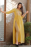 Yellow viscose rayon kurta with three-quarter sleeves and embroidery, women's Indian fashion on mannequin